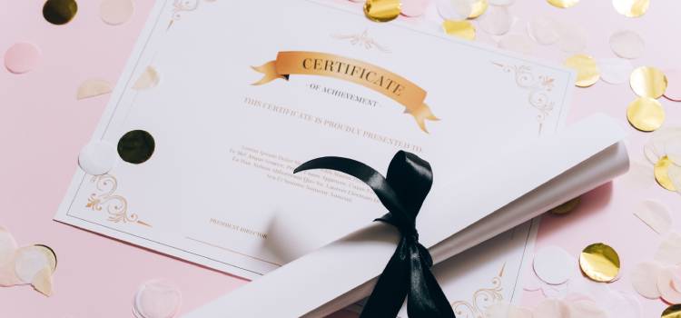 paper-certificate-with-rolled-up-paper-tied-in-a-bow