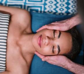 bioenergetic therapist soothing patients cheeks with two hands