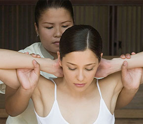 client receiving thai bodywork treatment