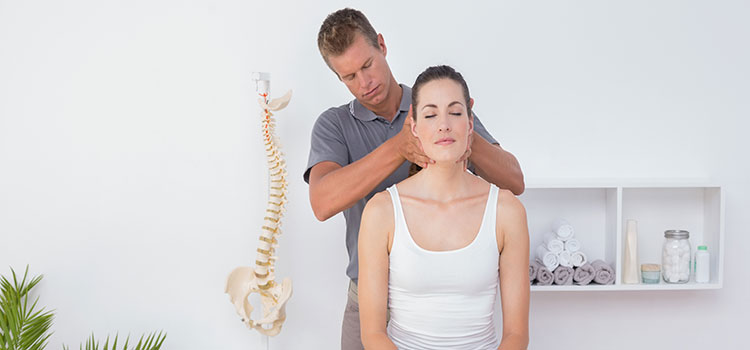 chiropractor works on woman's neck alignment