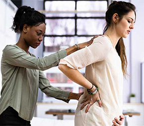 doula helps support an expecting mother